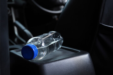 A bottle of water in the car