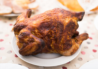 whole roasted chicken on a plate