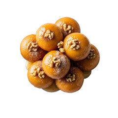 Fototapeta premium Delicious glazed donut - like sweets topped with walnuts arranged on a dark background perfect for dessert or a sweet treat