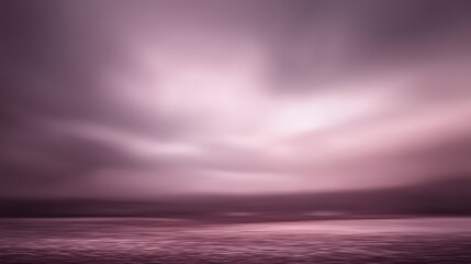 A serene, monochromatic landscape featuring a calm body of water under a soft, diffused sky in shades of pink and purple, evoking a tranquil and ethereal mood, blurred purple background