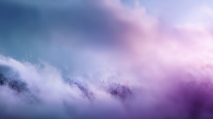 Fototapeta premium Dreamy mountain landscape shrouded in swirling mist and snow, featuring a gradient sky from cool blues to warm pinks and purples, creating an ethereal and atmospheric scene, blurred purple background