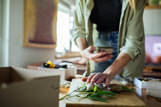 Woman taking photo of natural elements