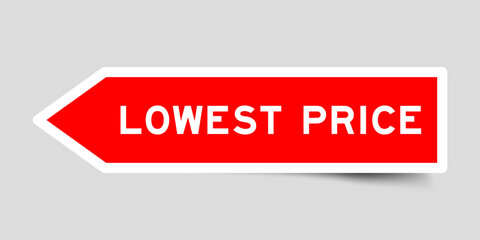 Fototapeta premium Red color arrow shape sticker label with word lowest price on gray background