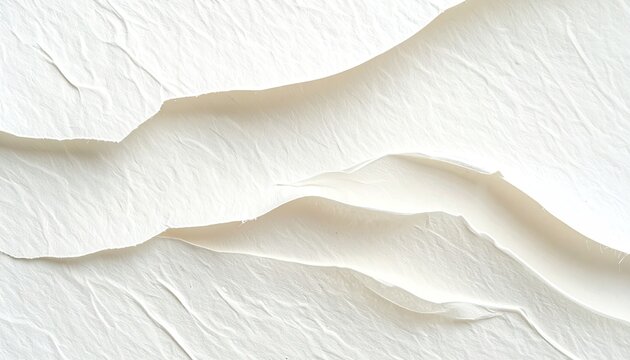 Abstract image of textured, off-white, layered material with undulating, sculpted forms and crevices, creating a sense of depth and movement