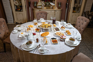 Festive banquet table with traditional dishes top view