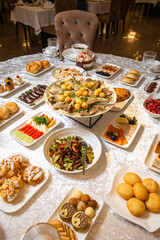 Festive banquet table with traditional dishes top view