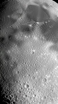 Slow tilt-up video of colossal, hyper-realistic full moon, ancient pockmarked lunar terrain detailed by raking light against deep space, twinkling stars. Concept of cosmic majesty