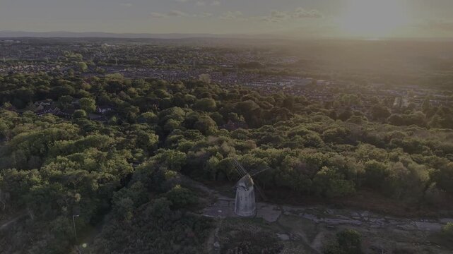 Stunning Bidston Hill and Windmill, slow clockwise sunset pan on a lovely autumnal afternoon, Wirral, UK