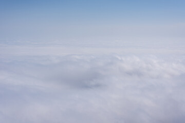 Naklejka premium Above the clouds view with soft atmospheric layers and tranquil sky 