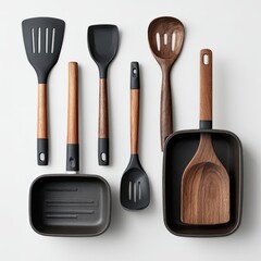 Kitchen Utensils and Pan Set.  Flatlay view of assorted dark gray and walnut-colored cookware