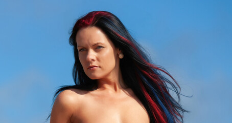 Young beautiful woman posing nude posing on the seaside