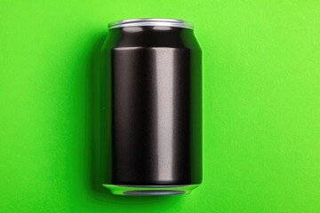 Black aluminum can on a lime green background