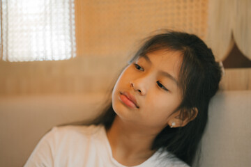 tired preteen girl sleeping on sofa at home, lying asleep, feeling lack of energy