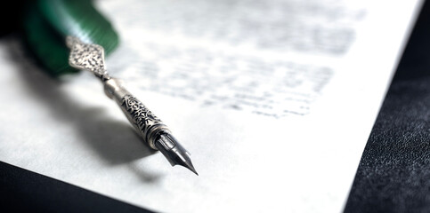 Writing with quill pen background concept for author, law or last will and testament legal issues