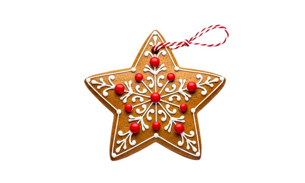 Gingerbread star cookie isolated on transparent background, decorated with icing and red candy balls