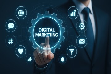 of a businessman in a dark suit pointing his finger towards a digitally illustrated gear wheel with the words "digital marketing" highlighted in bright blue, surrounded by various technology icons,...