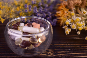 Herbal medicine against a background of dried herbs. Close-up.
