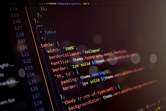 Macro shot of CSS-in-JS code with highlighted syntax on a dark screen, showing modern frontend styling, responsive layout, and web UI component design for digital applications.