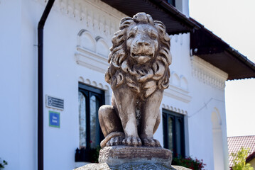 lion statue in front of a building