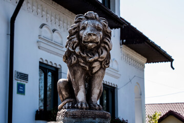 lion statue in front of a building