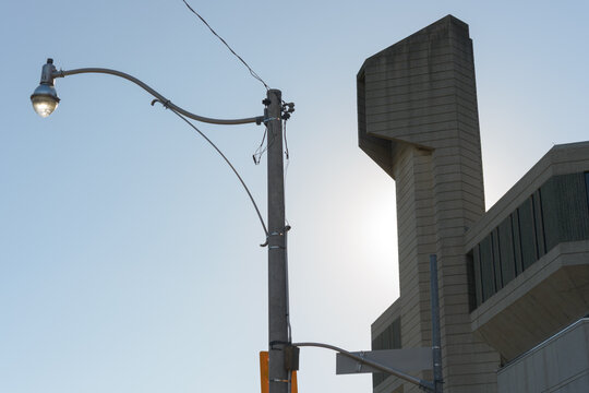 looking east on Harbord St to a light standard and detail of Robarts Library, University of Toronto, in Brutalist style, by Warner, Burns, Toan & Lunde, 1973