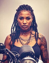 portrait of beautiful biker woman with tattoos