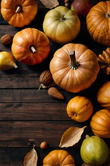 Cozy autumn composition on a wooden table with gifts of nature: colorful pumpkins, apples, pears