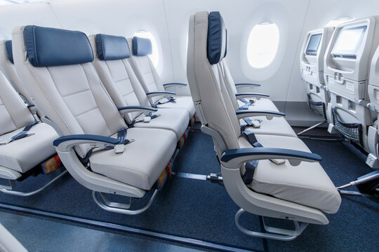 White economy class seats with blue headrests inside a widebody aircraft at Viracopos Airport, Brazil, on September 16, 2022.