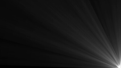 Bright white light rays emanating from a corner against a dark black background