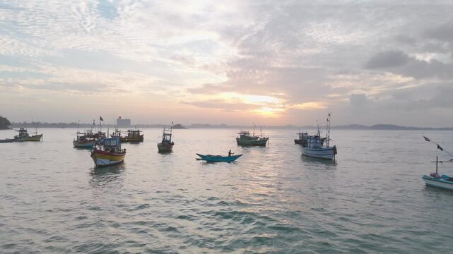 Tranquil Morning Fishing Harbor with Boats and Paddler at Golden Hour