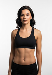 Studio portrait of strong confident woman in black activewear