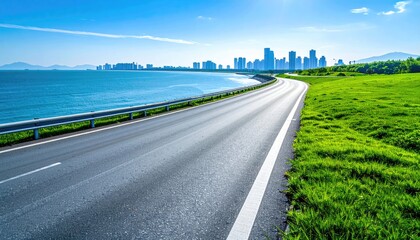 Fototapeta premium Coastal Road Curving to City Skyline View. Transport and Travel Background photo