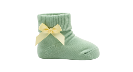 Isolated mint baby sock with a yellow bow for a newborn infant or young toddler child