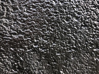 Shiny metallic silver paint graffiti rough texture wall wallpaper background close-up	