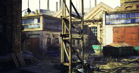 A dilapidated industrial site features a rusted metal structure surrounded by derelict buildings and scattered trash. The area is bathed in warm light, highlighting neglect and decay.