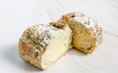 Close-up of Moldy bread on cutting board