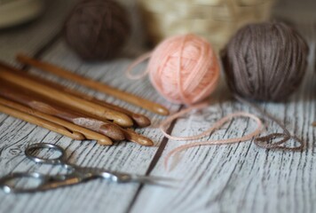 Clews balls of yarn wool and crochet hooks and a basket photo 