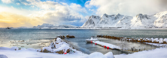 Amazing winter scenery with wooden houses in small fishing village and snowy  mountain peaks near Valberg.