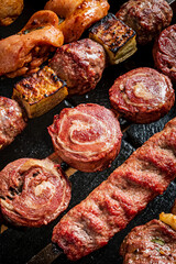 Sizzling pieces of meat and colorful vegetables are grilling together at a joyful summer barbeque
