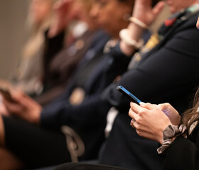 Many people at a high pressure business meeting