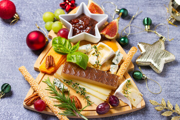 Christmas cheese platter. Cheese selection and appetizers for Christmas or New Year party dinner