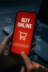 Human hand holding a smartphone displaying "Buy Online" text with shopping cart icon, fingers pressing the touchscreen to access online purchasing information, dark background with laptop and...