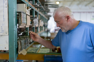 Control of materials for the production of PVC and aluminum profiles. A senior craftsman selects the material for the production of windows and doors.