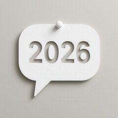 White speech bubble with the year 2026 cut out, attached to a light gray background with a white pin.