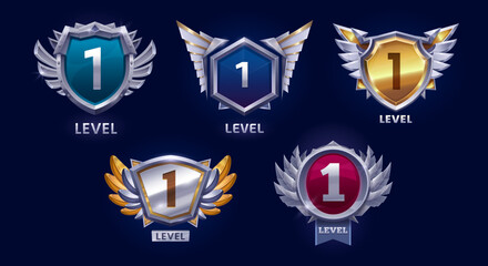 Game victory rank level up badge icons, shields asset. Vector set of shiny level 1 gaming emblems with winged shields and metallic finishes. Gui elements for ranking system or rewards in applications