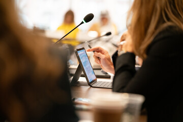 Many people at a high pressure business meeting