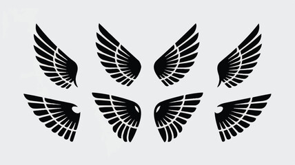 Obraz premium A minimalist set of six black wing silhouettes arranged in two rows against a white background. 