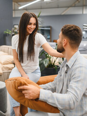 Obraz premium Happy couple shopping for new living room furniture