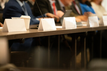 Many people at a high pressure business meeting
