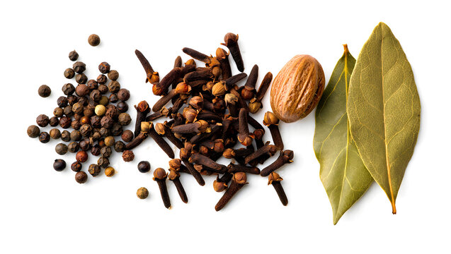 Aromatic spices whole black peppercorns cloves nutmeg and bay leaves for culinary use